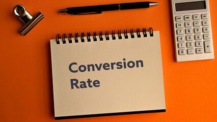 There is notebook with the word Conversion Rate.It is as an eye-catching image.