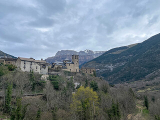 Fototapeta na wymiar small village of Torla, gateway to the Ordesa y Monte Perdido National Park in the Spanish Pyrenees, Aragon, Spain, San Salvador Church, horizontal