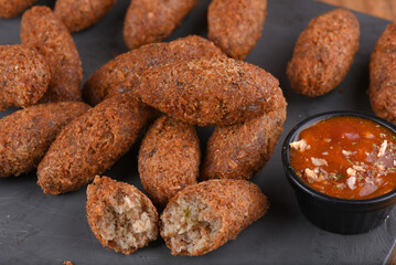 Fried and breaded codfish cake, fish empanadas, codfish cake, Brazilian-style codfish cakes, meat disc