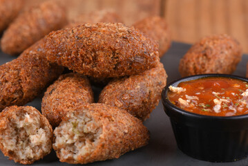 Fried and breaded codfish cake, fish empanadas, codfish cake, Brazilian-style codfish cakes, meat disc