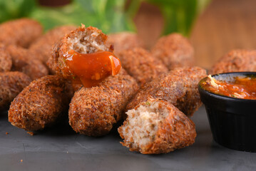Fried and breaded codfish cake, fish empanadas, codfish cake, Brazilian-style codfish cakes, meat disc