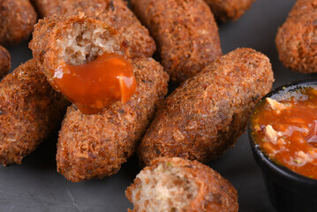 Fried and breaded codfish cake, fish empanadas, codfish cake, Brazilian-style codfish cakes, meat disc