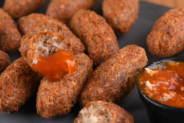 Fried and breaded codfish cake, fish empanadas, codfish cake, Brazilian-style codfish cakes, meat disc