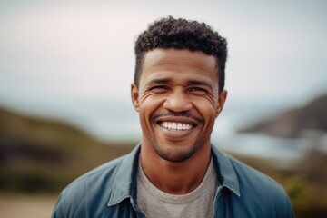 Portrait of a handsome young african american man smiling outdoors