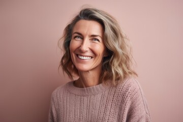 Lifestyle portrait photography of a cheerful woman in her 40s wearing a cozy sweater against a pastel or soft colors background. Generative AI