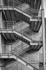 External  Steel Staircase on a Gray Cinder Block Wall.