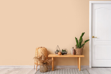 Interior of stylish room with florariums on wooden bench