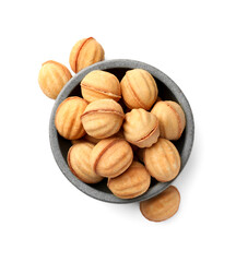 Bowl and delicious nut shaped cookies with condensed milk on white background, top view