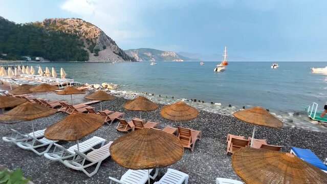 Walk along Beach of Turunc village, enjoy sun between straw umbrellas and loungers. Beach has blue flag and a clean sea. There are also restaurants, you can eat here