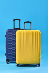 Big suitcases on blue background