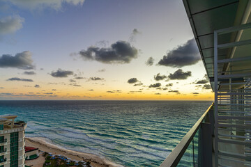 Sunrise on the tropical beach of Cancun, beautiful sea in Mexico. Beautiful shining clouds. Place for text