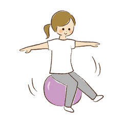 バランスボールに乗っている女性