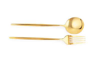 Golden spoon and fork on white background