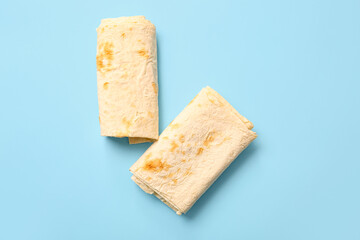 Fresh thin lavash on blue background