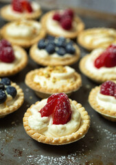 Mini berry pies on a metal plate