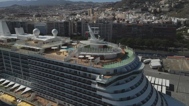 Revealing Drone Shot of Big European City Next To Large Ocean Liner, Spain