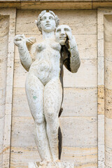 Ancient sculptures in the architecture of the city. Historical and cultural heritage. Background.