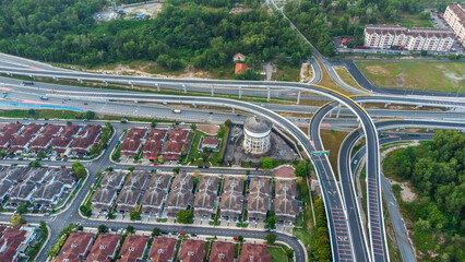 Aerial view of residential area with green asphalt road and residential houses directly above viewpoint. View of suburbs and city district. Real estate and housing market concept. - 601572568