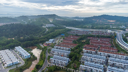 Aerial view of residential area with green asphalt road and residential houses directly above viewpoint. View of suburbs and city district. Real estate and housing market concept. - 601572597