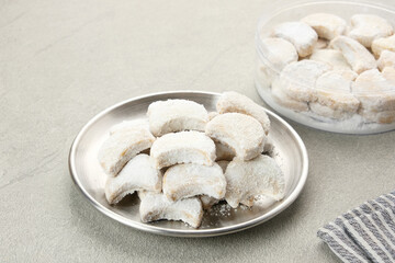 Kue Putri Salju or Snow White Cookies with crescent shaped. Made from flour, sugar and butter coated with powdered sugar. 
