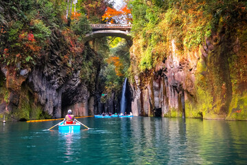 Miyazaki, Japan - Nov 24 2022: Takachiho Gorge is a narrow chasm cut through the rock by the Gokase River, plenty activities for tourists such as rowing and trekking through beautiful nature - 601576973