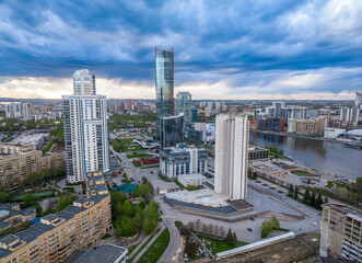 Yekaterinburg city with Buildings of Regional Government and Parliament, Dramatic Theatre, Iset Tower, Yeltsin Center, panoramic view at summer sunset.