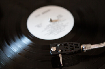 Close-up vintage vinyl record player. Retro audio equipment turntable.
