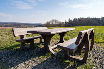 Table with benches in the landscape to rest for hikers and walkers