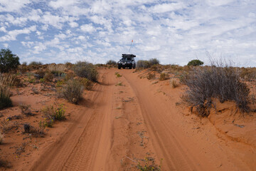 Aerial view of beach driving with a 4WD vehicle on Moreton Island