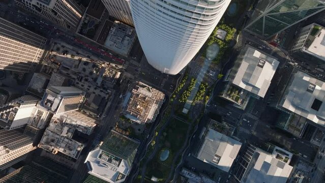 Top down panning footage of downtown skyscrapers. Fly over Salesforce Tower. San Francisco, California, USA
