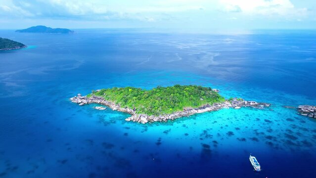 aerial view of the Similan Islands, the Andaman Sea, with natural blue waters, tropical seas, impressive views of the island's beauty. The island is shaped like a heart.