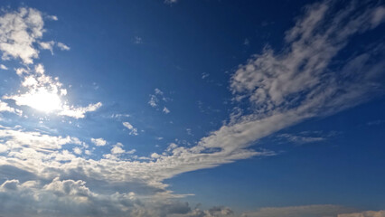 Fototapeta na wymiar nebulosity rare cute white cumulus clouds in the summer sky - photo of nature