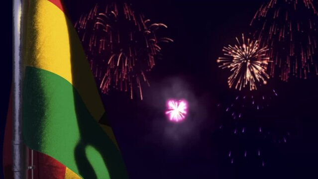 hanging Ghana flag on fireworks sky bokeh bg