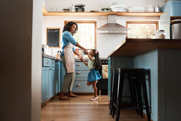 Happy, mother with child dancing in kitchen and at their home. Family with love, entertainment or...