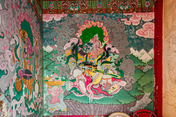 Sikkim, India - 22nd March 2004 : Colorful Buddist murals , piece of graphic artwork that is painted directly to inside wall of Andey or Andhen Monastery. Murals depict earlier births of God Buddha.