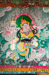 Sikkim, India - 22nd March 2004 : Beautiful colorful Buddist murals , piece of graphic artwork that is painted directly to inside wall of a Monastery. Often murals depict earlier births of God Buddha.