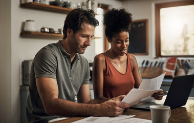 Finance, couple and laptop in a kitchen for planning, budget and savings or paying bills together in their home. Marriage, online and people with documents for tax, mortgage or home loan or insurance
