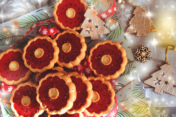 Thumbprint breakfast cookies with raspberry jam. Homemade freshly baked shortbread cookies, Christmas atmospheric mood. Happy New Year