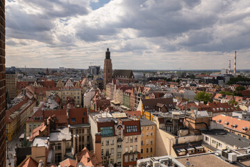 Fototapeta na wymiar View from above, aerial Wroclaw central market square with old houses. Historical capital of Silesia, Europe. City hall architecture buildings. Old town landmark cathedrals church. Travel tourist