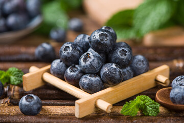 fresh blueberry fruit on wooden table.