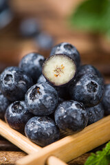 fresh blueberry fruit on wooden table.