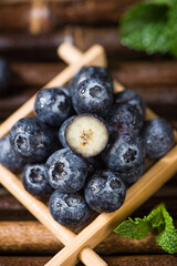 fresh blueberry fruit on wooden table.
