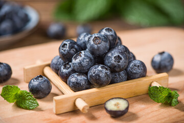 fresh blueberry fruit on wooden table.