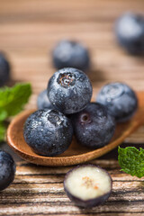 fresh blueberry fruit on wooden table.