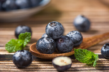 fresh blueberry fruit on wooden table.