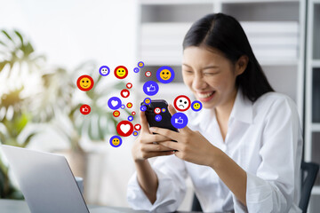 Businesswoman using mobile phone play social in home office.