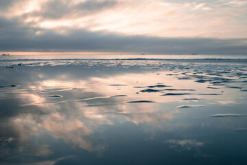 A beautiful sunset on a calm day by the sea