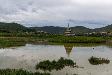 Fototapeta na wymiar The pond outside Songzanlin Temple, is Tibetan Buddhist monastery in Zhongdian city, Shangri-La, Yunnan province, China, travel and tourists, famous place and landmark, religious and holiday concept