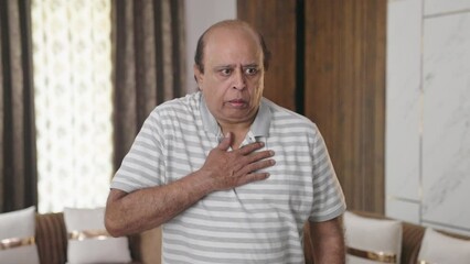 Fat Indian old man having an Asthma attack