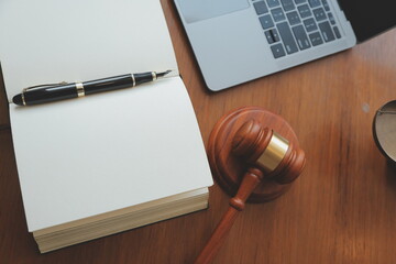 Business and lawyers discussing contract papers with brass scale on desk in office. Law, legal services, advice, justice and law concept picture with film grain effect